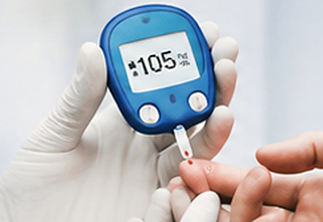 Blood sugar being checked with a glucometer